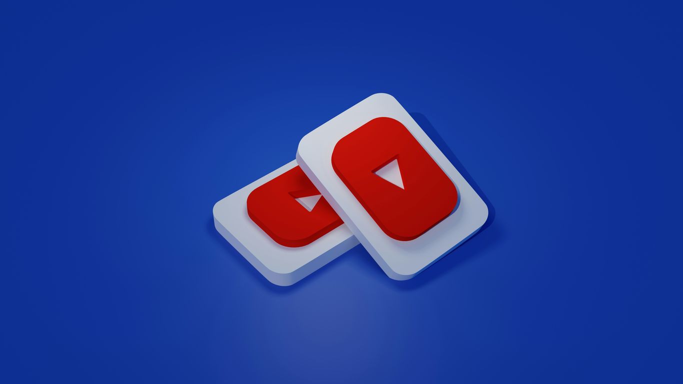 a pair of white and red play buttons on a blue background