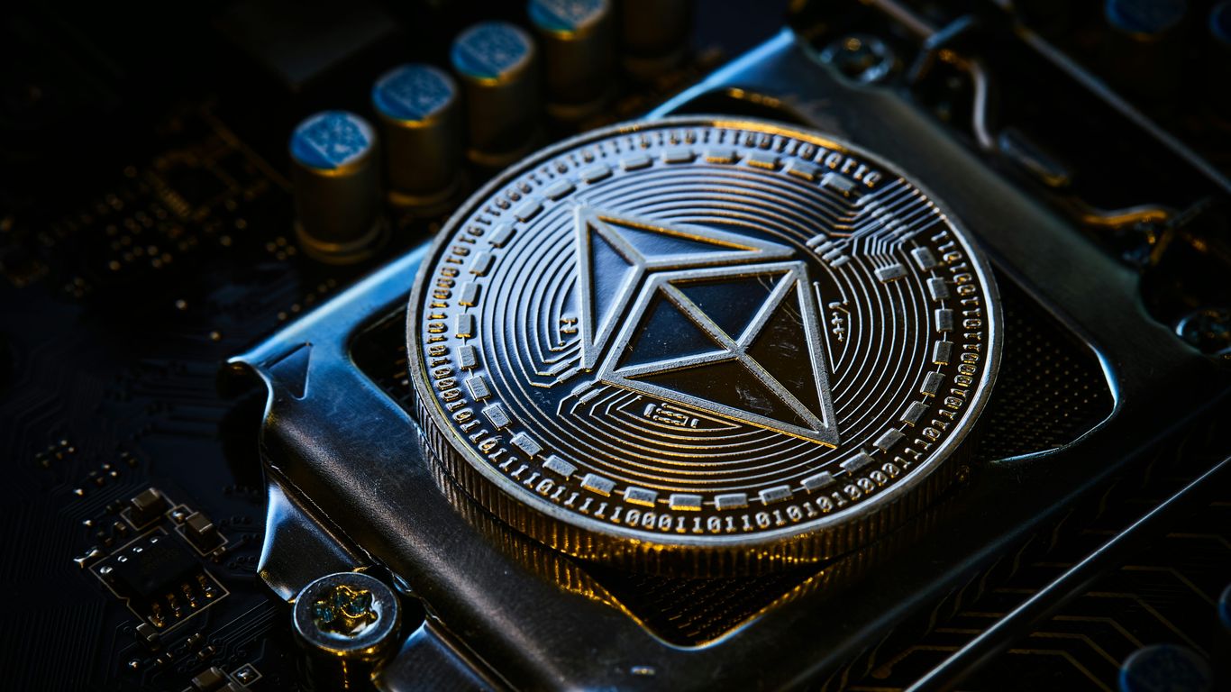 A metallic Ethereum coin on a circuit board background.