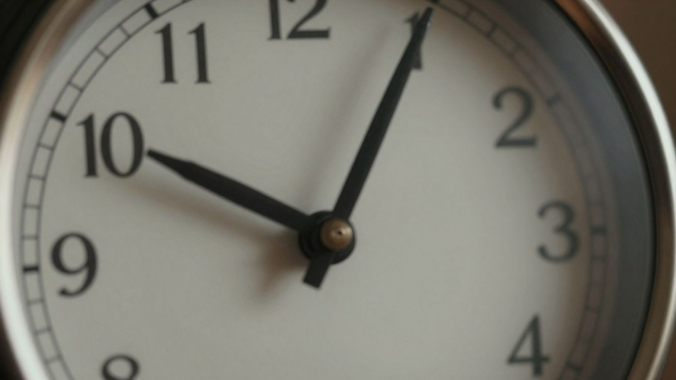 Clock face with hands indicating a specific time.