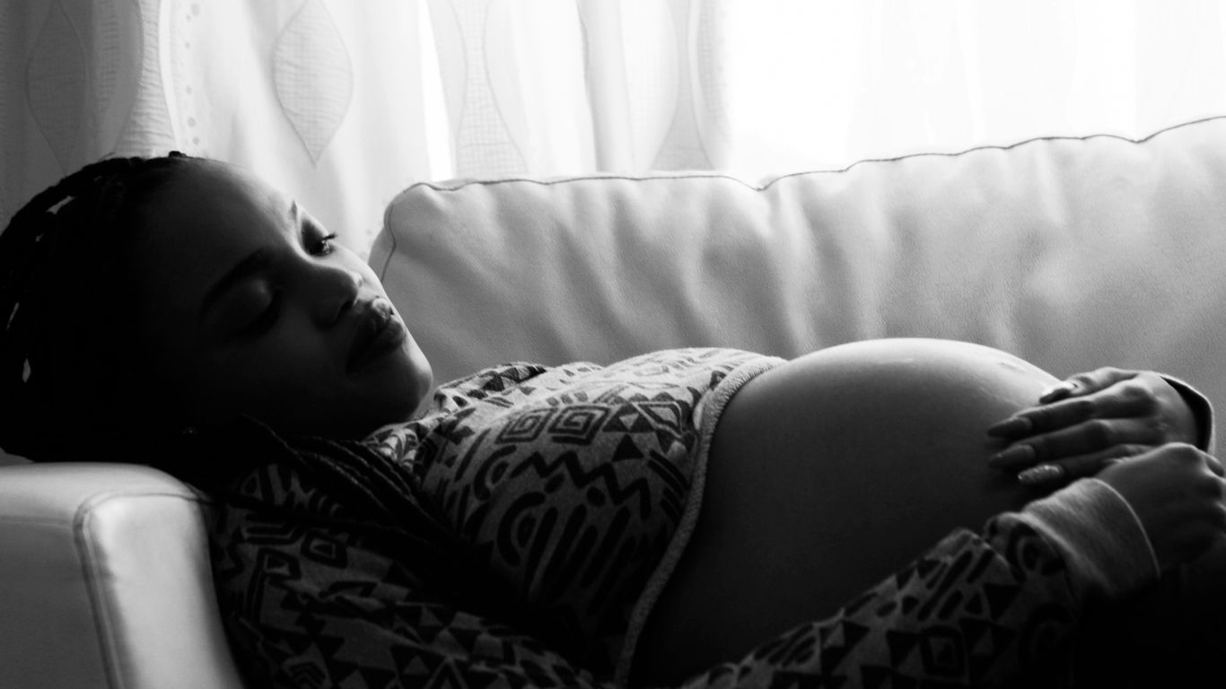 pregnant woman lying on the sofa