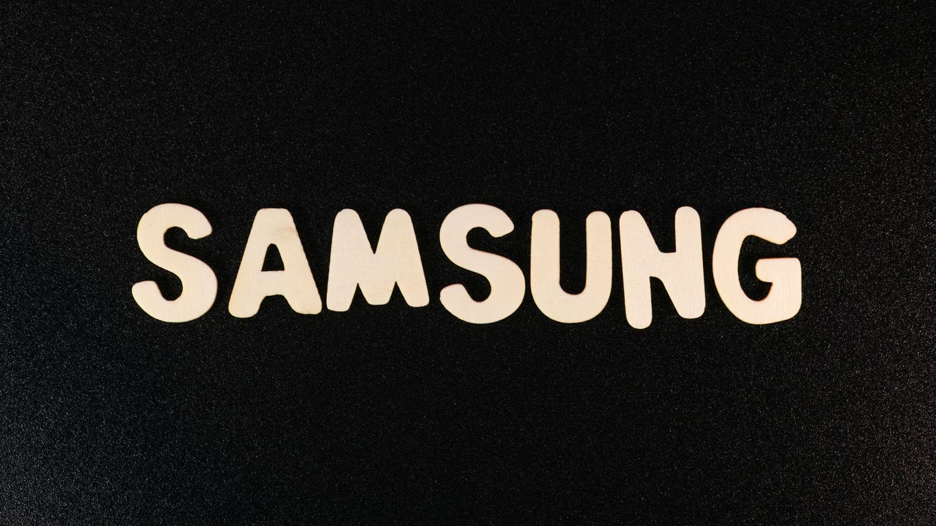 a close up of a samsung logo on a black surface