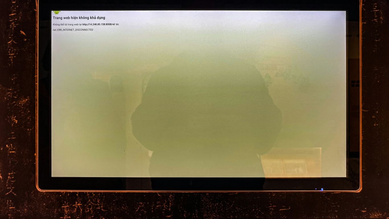 A computer screen shows a hazy green display.