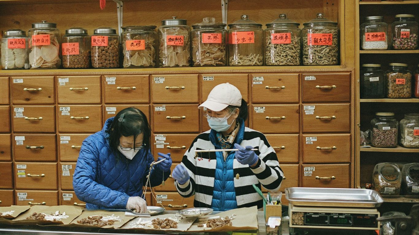 a couple of people working in a laboratory