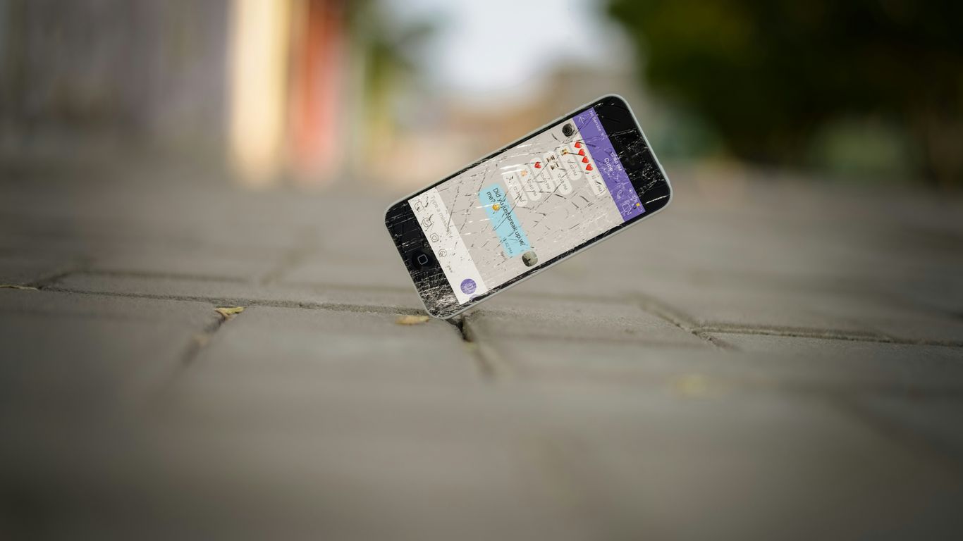 selective focus photo of iPhone balance on brick pavement