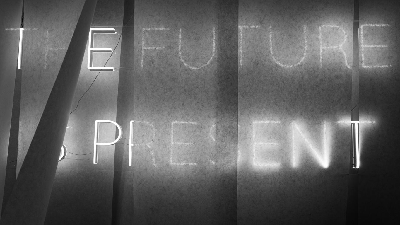 a black and white photo of a blackboard with writing on it