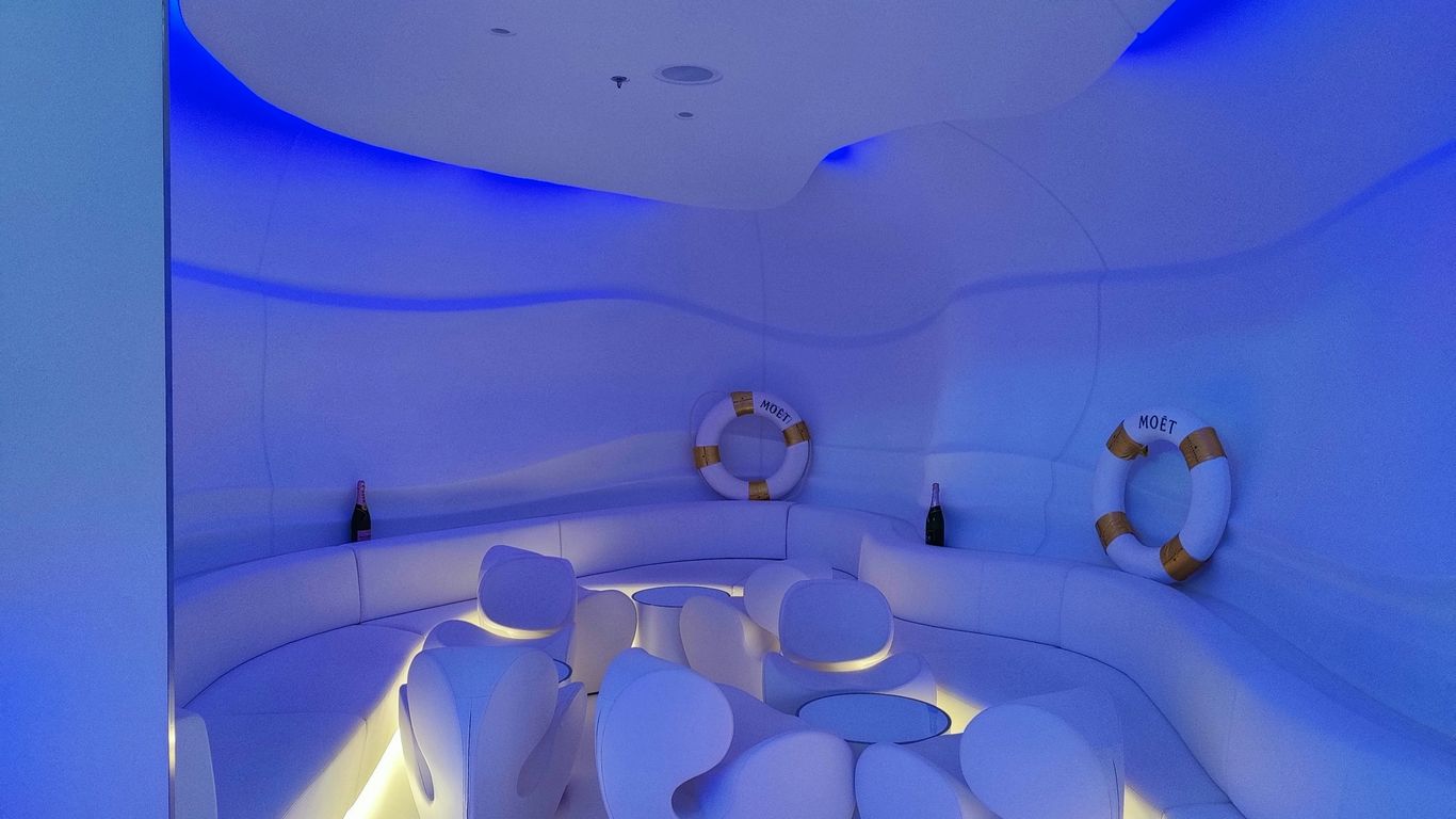 a room with a table and chairs