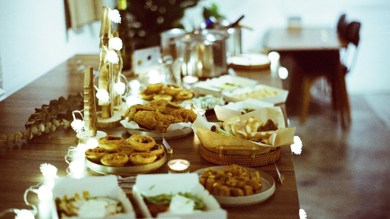 a wooden table topped with lots of food