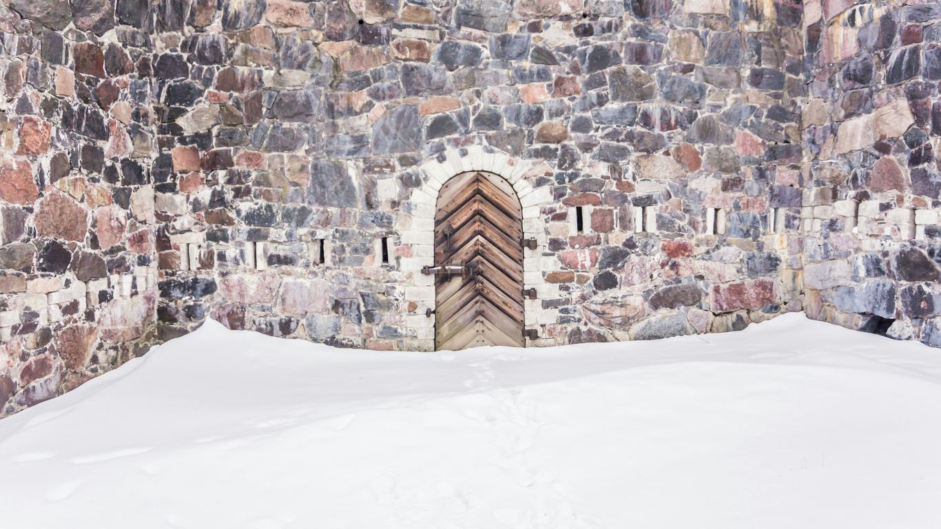 snow in front of wooden door