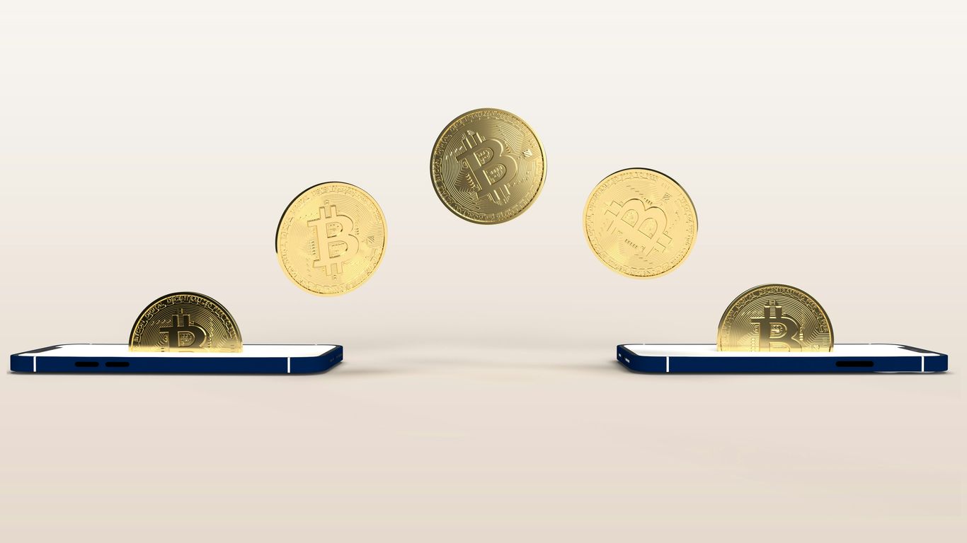 a bunch of coins flying out of a cell phone