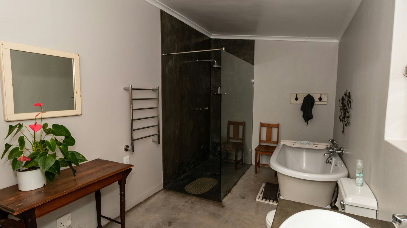 a bathroom with a tub sink and toilet