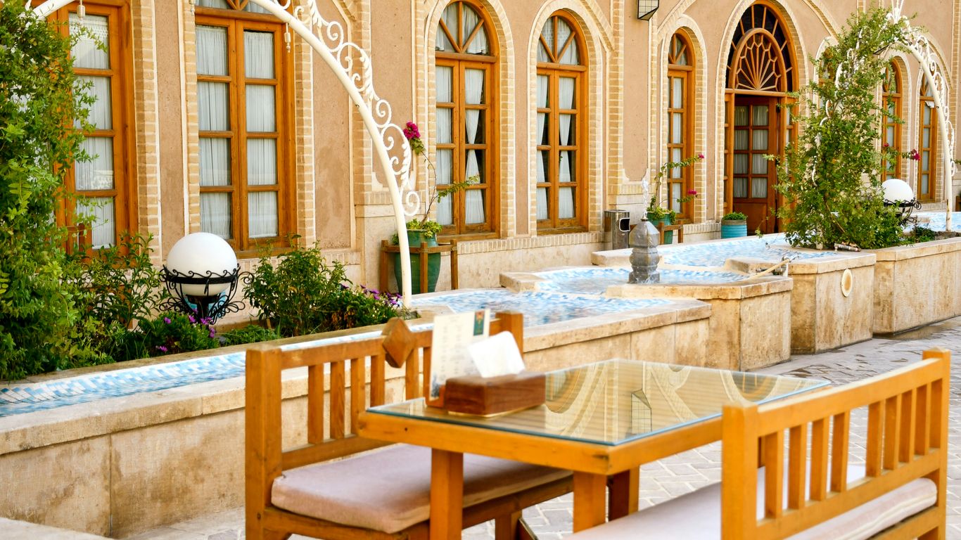 a table and chairs outside a building