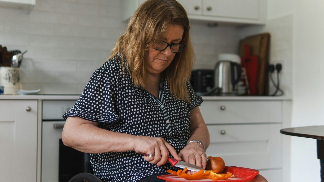 person with disability using assistive technology