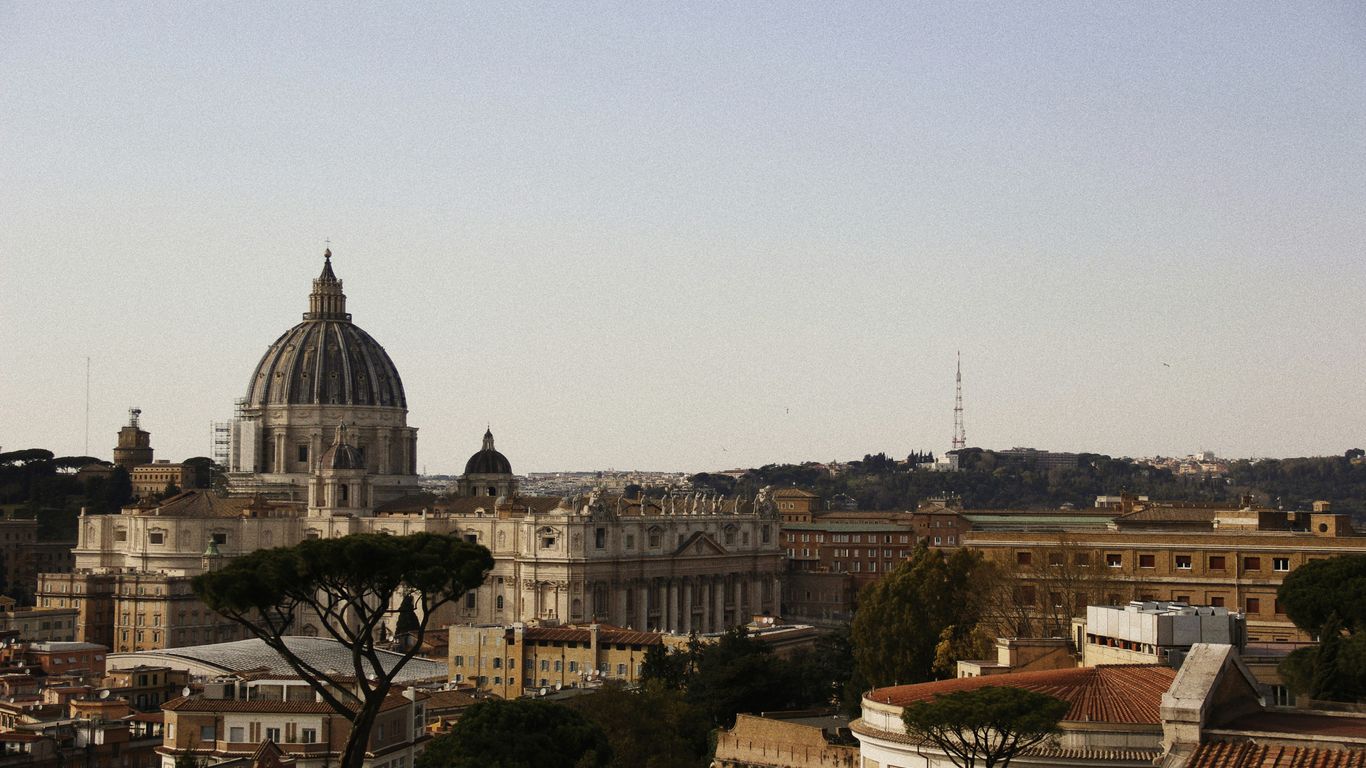 a view of a city with buildings and a dome