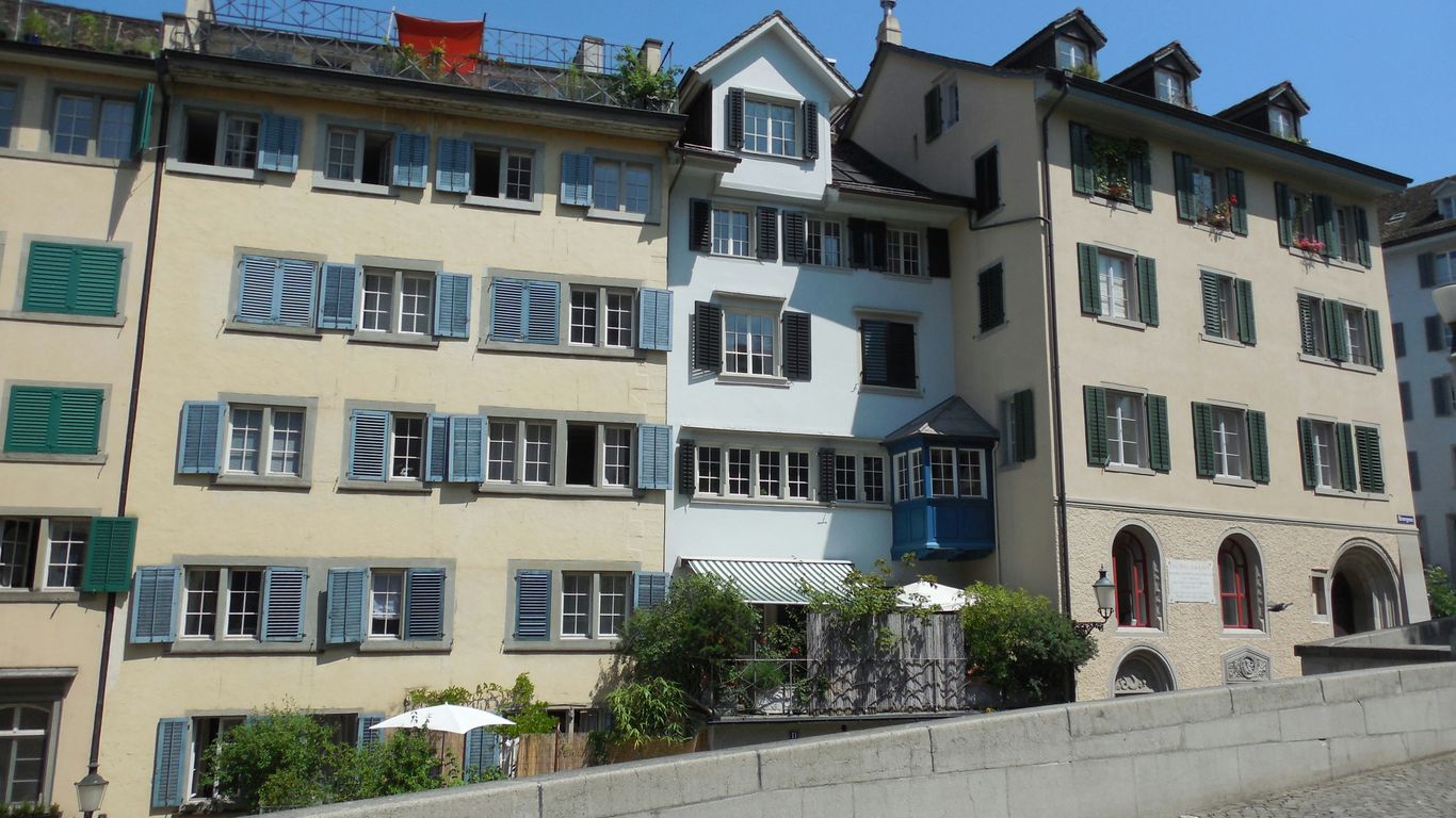 a large building with many windows and shutters