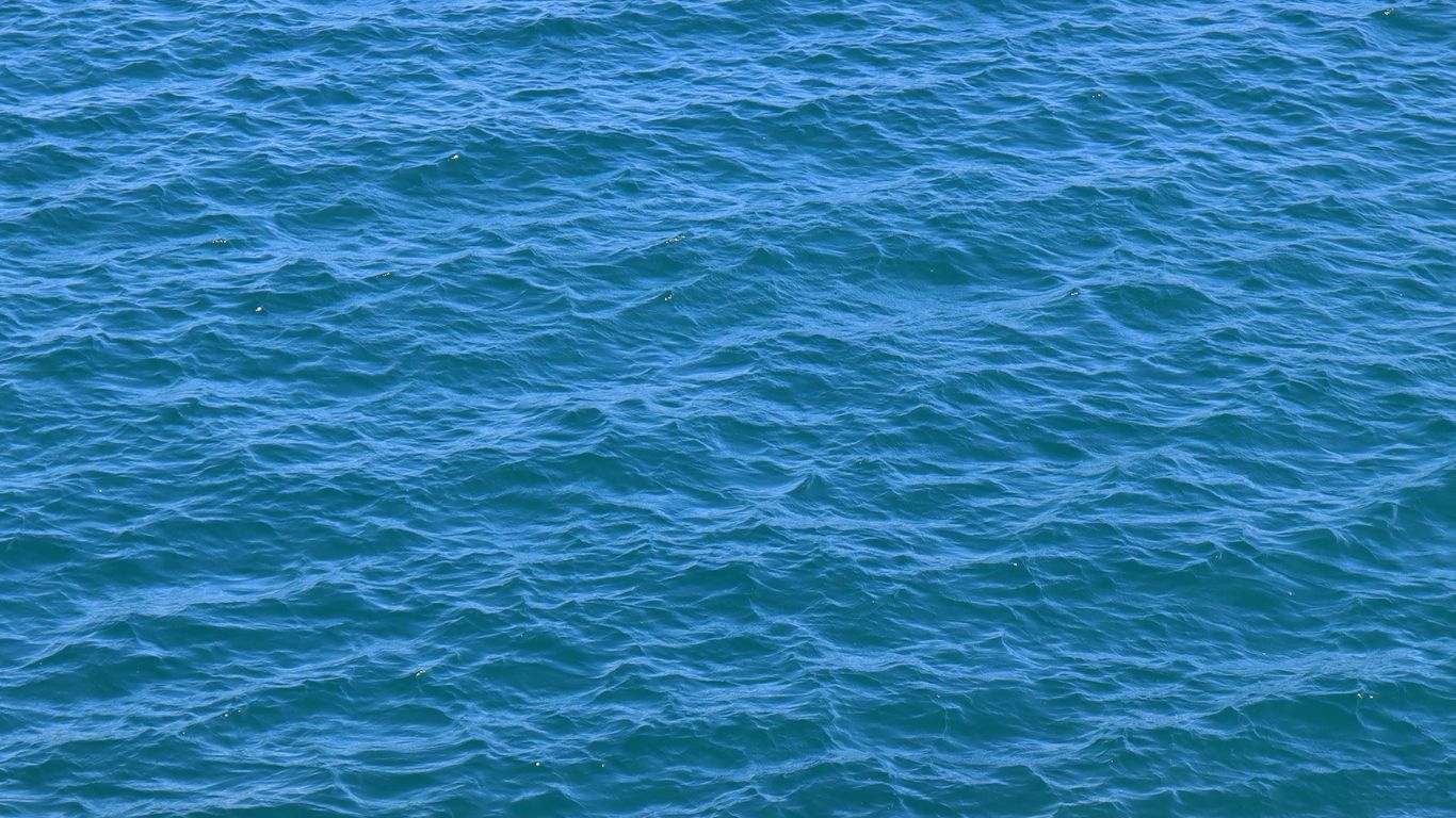 a large body of water with a boat in it