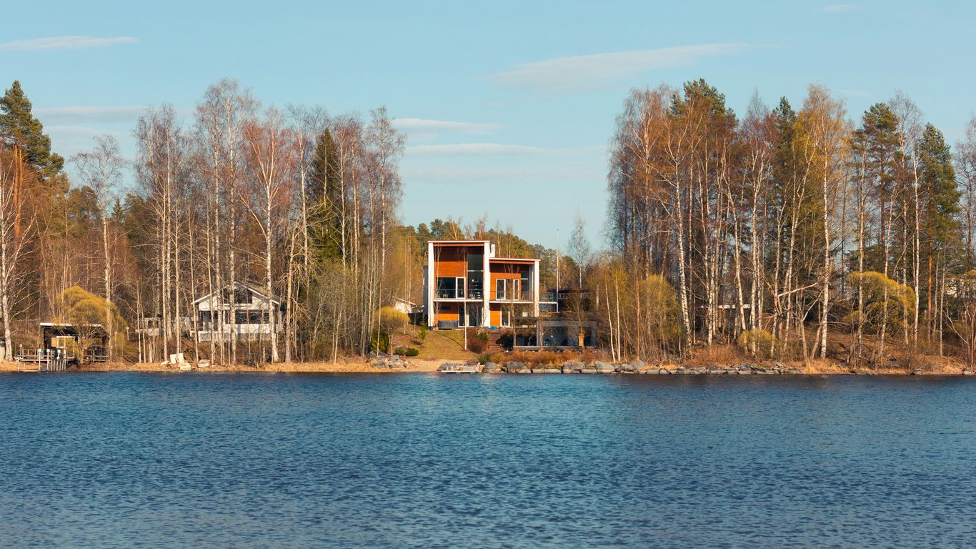 a large body of water surrounded by trees