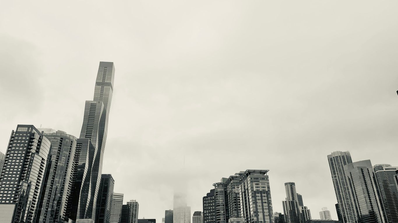 a city skyline with a bridge