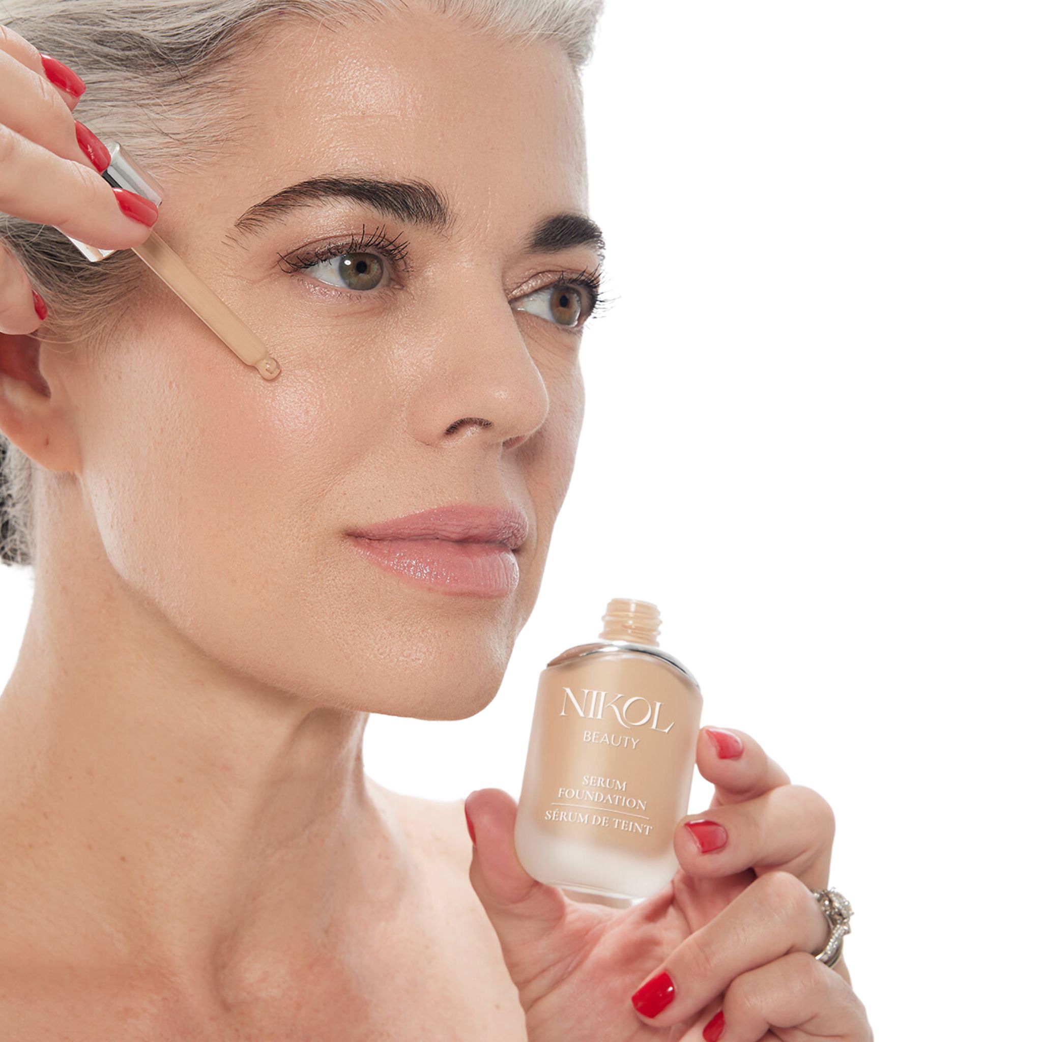 Nikol Johnson Applying Serum Foundation