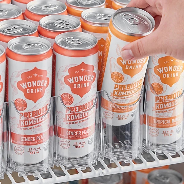 The Assure Parts universal gravity-feed organizer sitting on a wire shelf in a generic commercial refrigerator.
