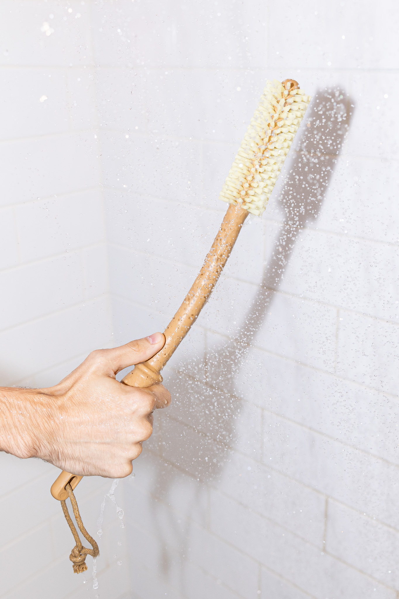 Gentle shower brush rinsed under running water