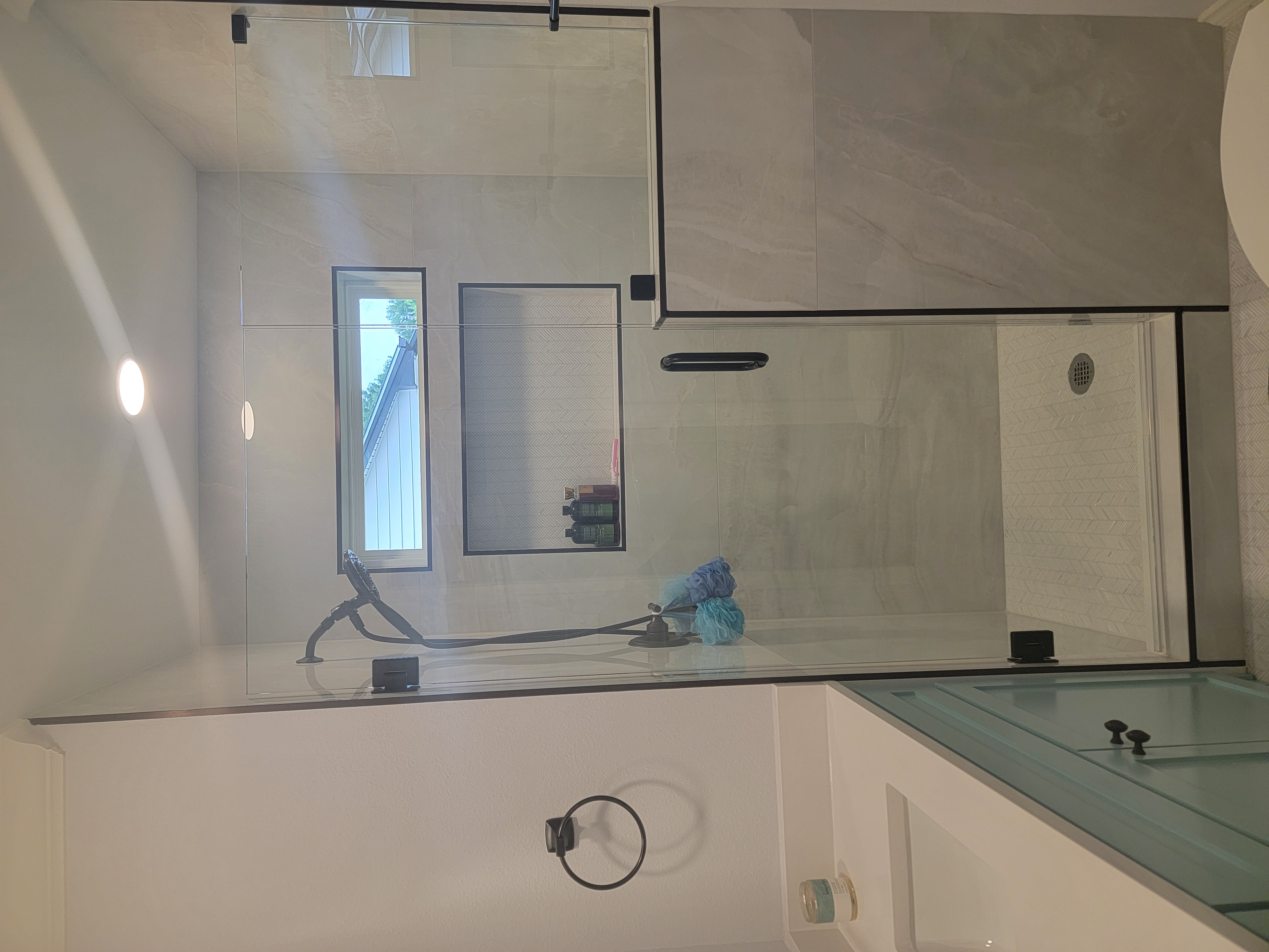 Elegant porcelain tile shower with cascading water.