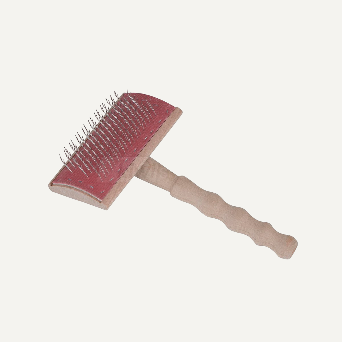 A wooden pet grooming brush with fine metal bristles on a red pad.