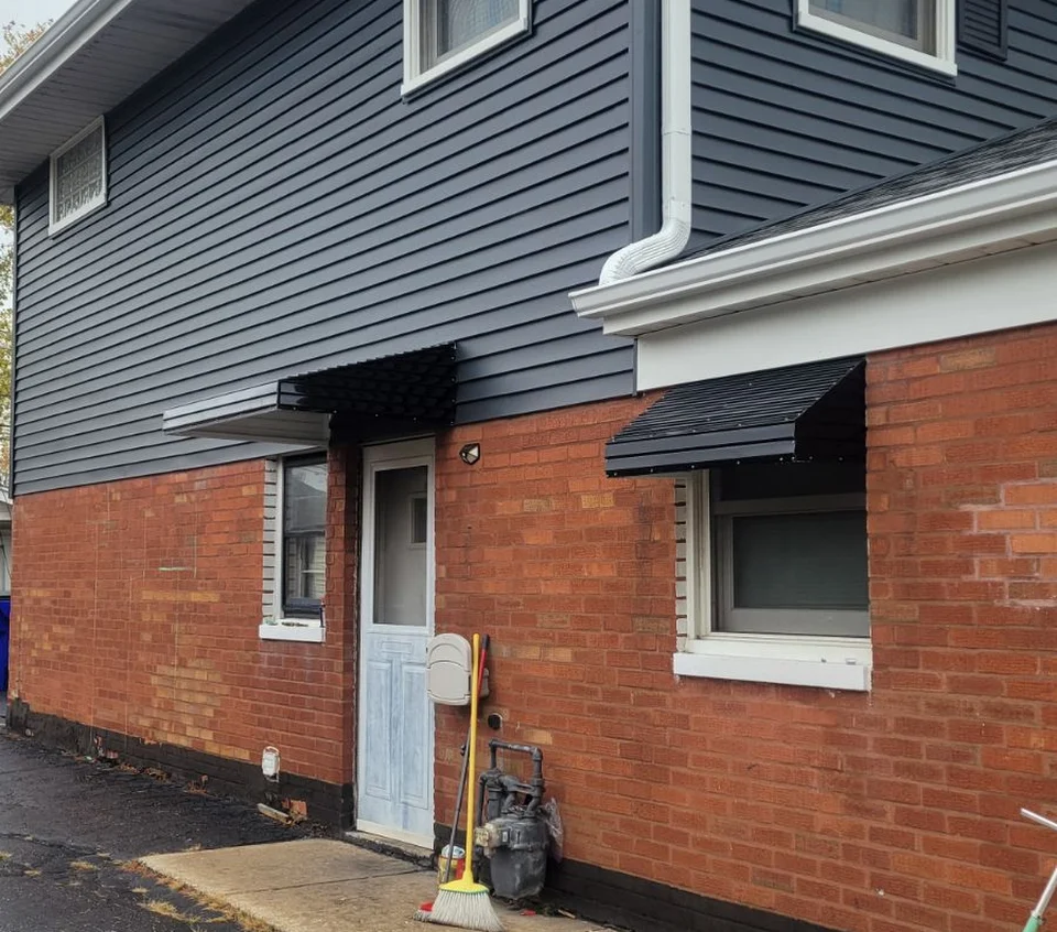 Aluminum awning protecting a sunny patio