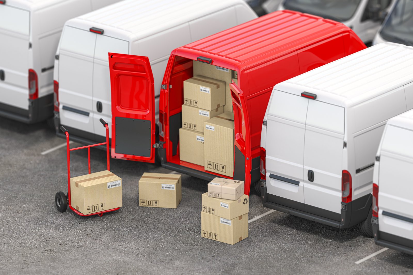 Delivery vans parked with boxes and a hand truck