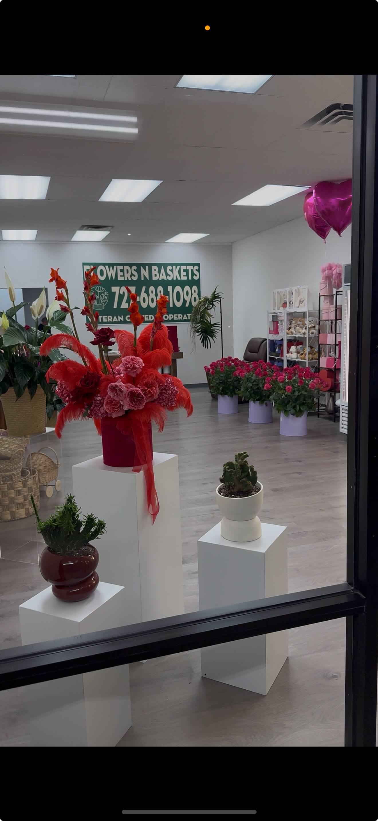 A lush interior filled with fresh, handcrafted floral arrangements in a boutique setting