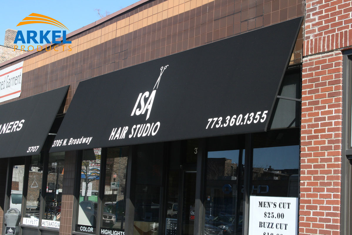 Black awnings over storefronts for businesses in the city