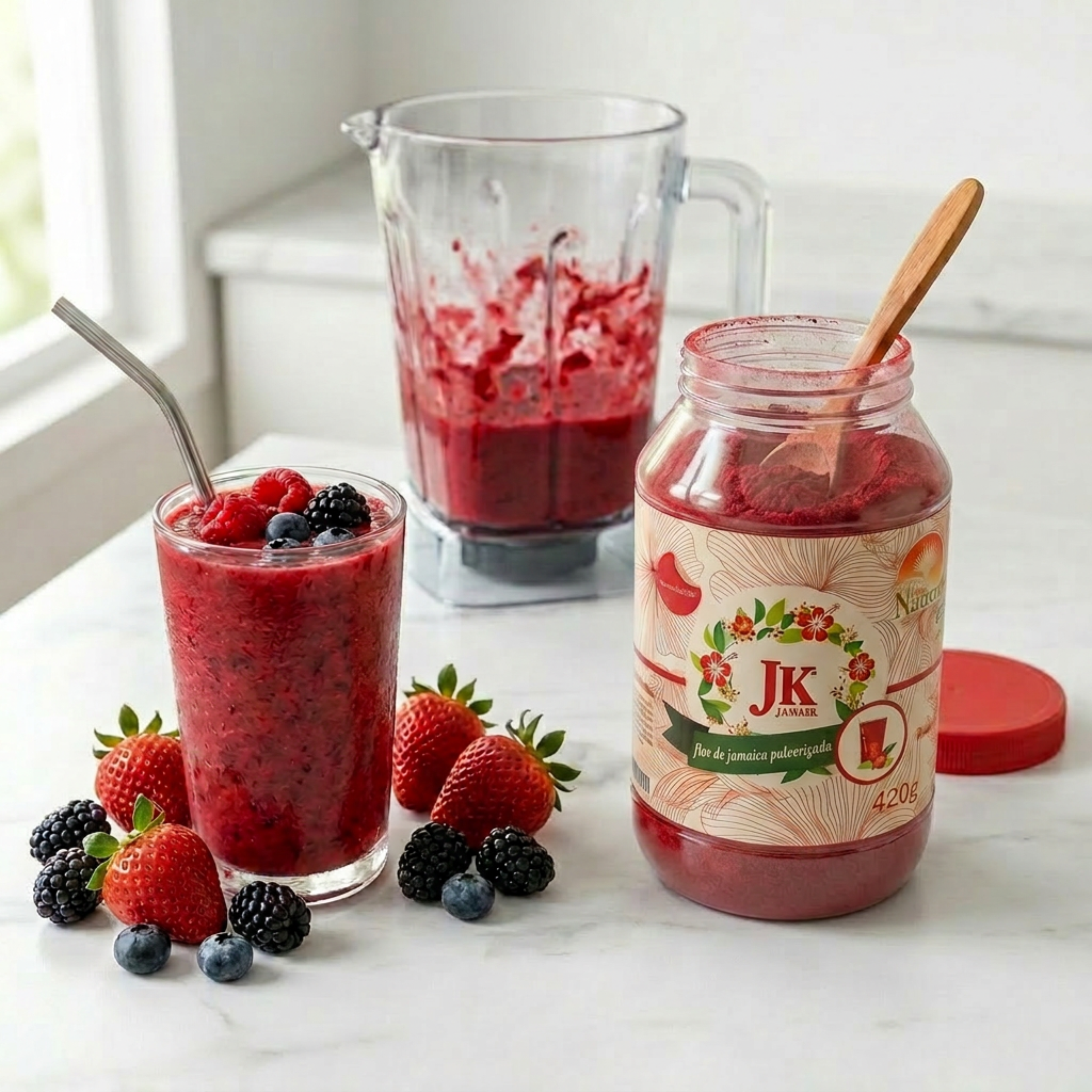 Berry smoothie ingredients and finished drink with blender and jar of JK JAMAIK.