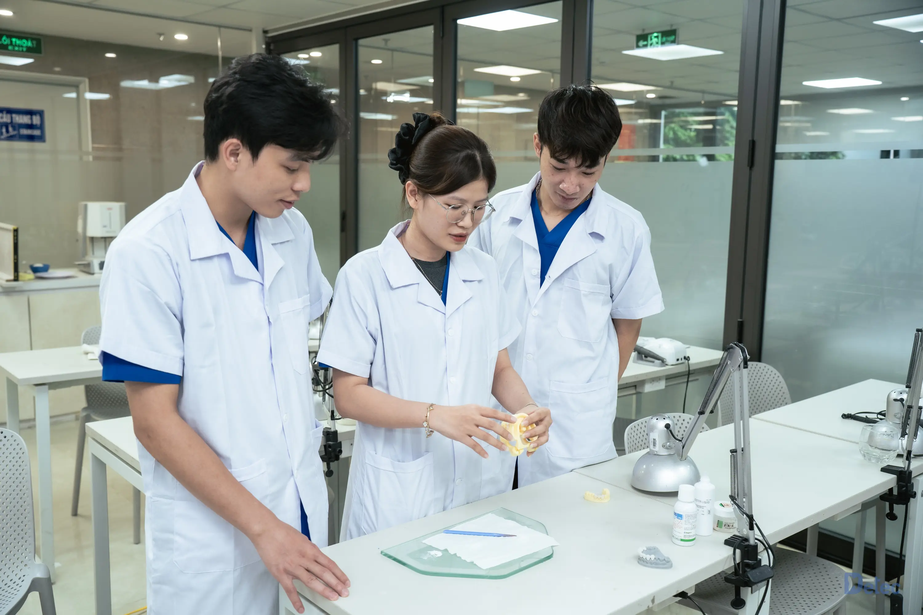 A clean, professional laboratory workspace featuring modern dental diagnostic equipment