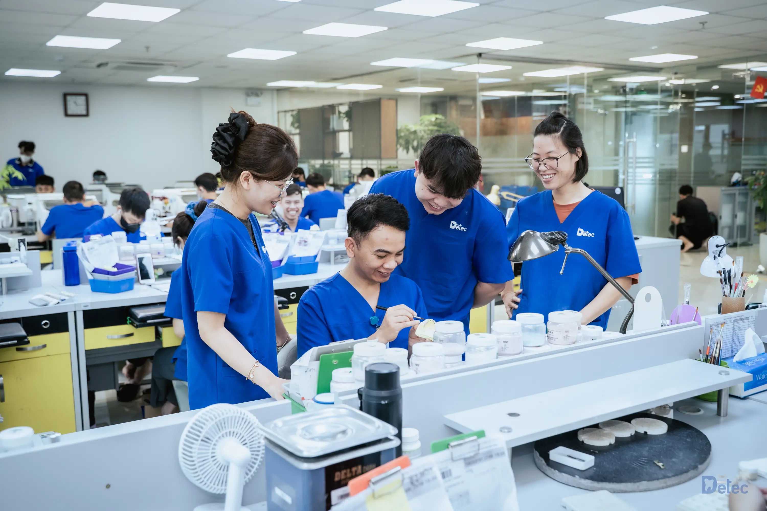 Advanced lab professionals working on restorations