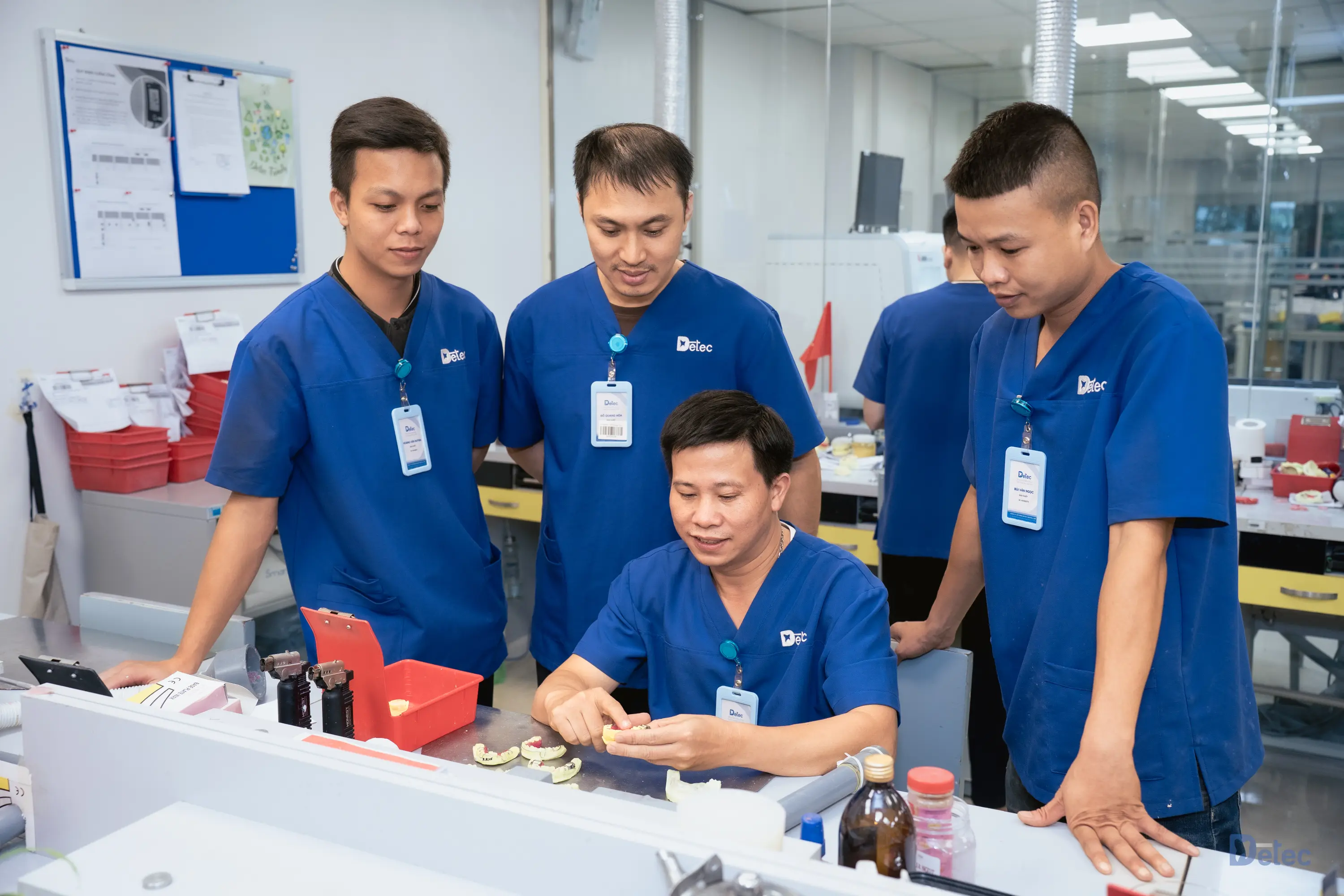 Technician inspecting dental prosthetic quality