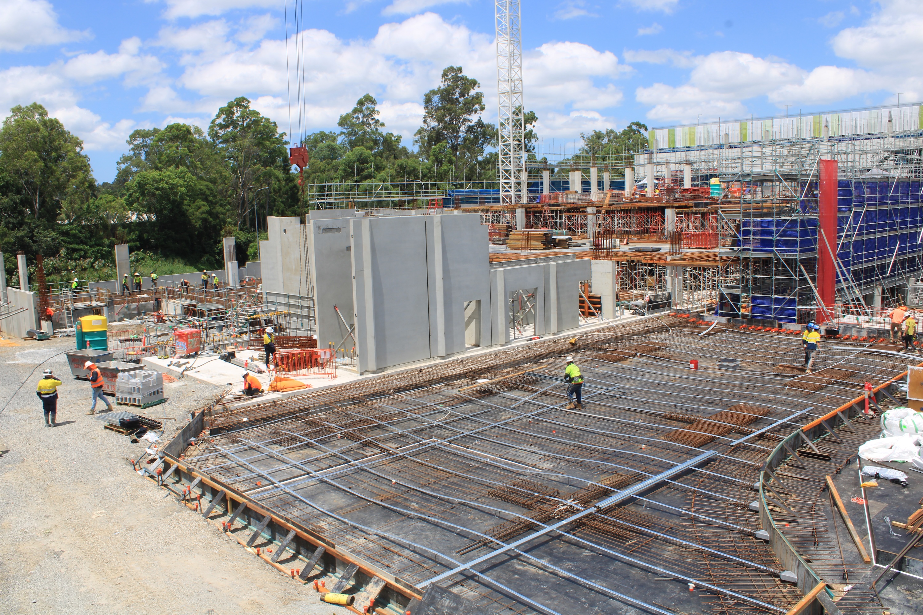 Workers and machinery at an active construction site