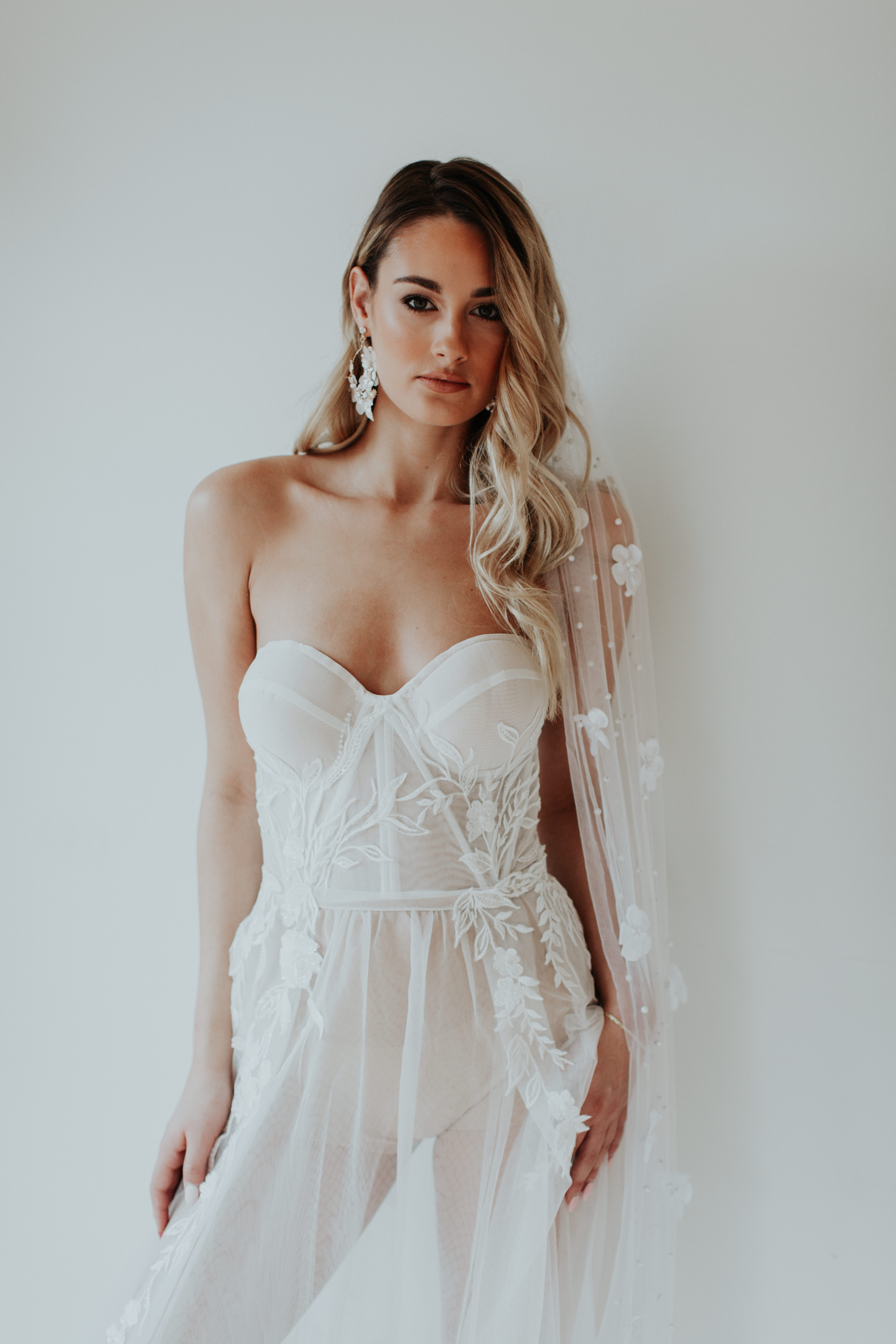 Bridal gloves styled with a classic wedding dress