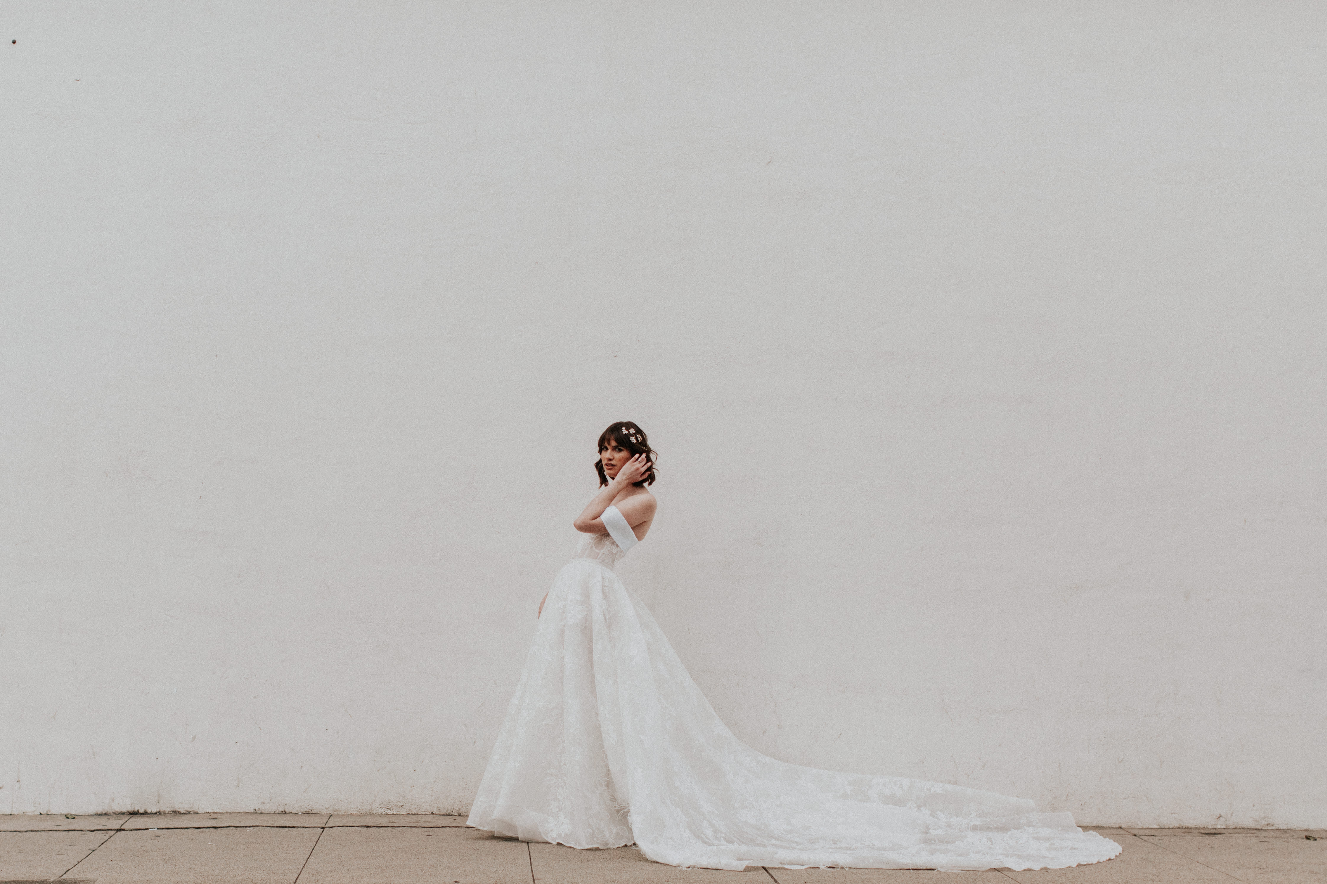 Satin ribbon tied around an A-line bridal waist