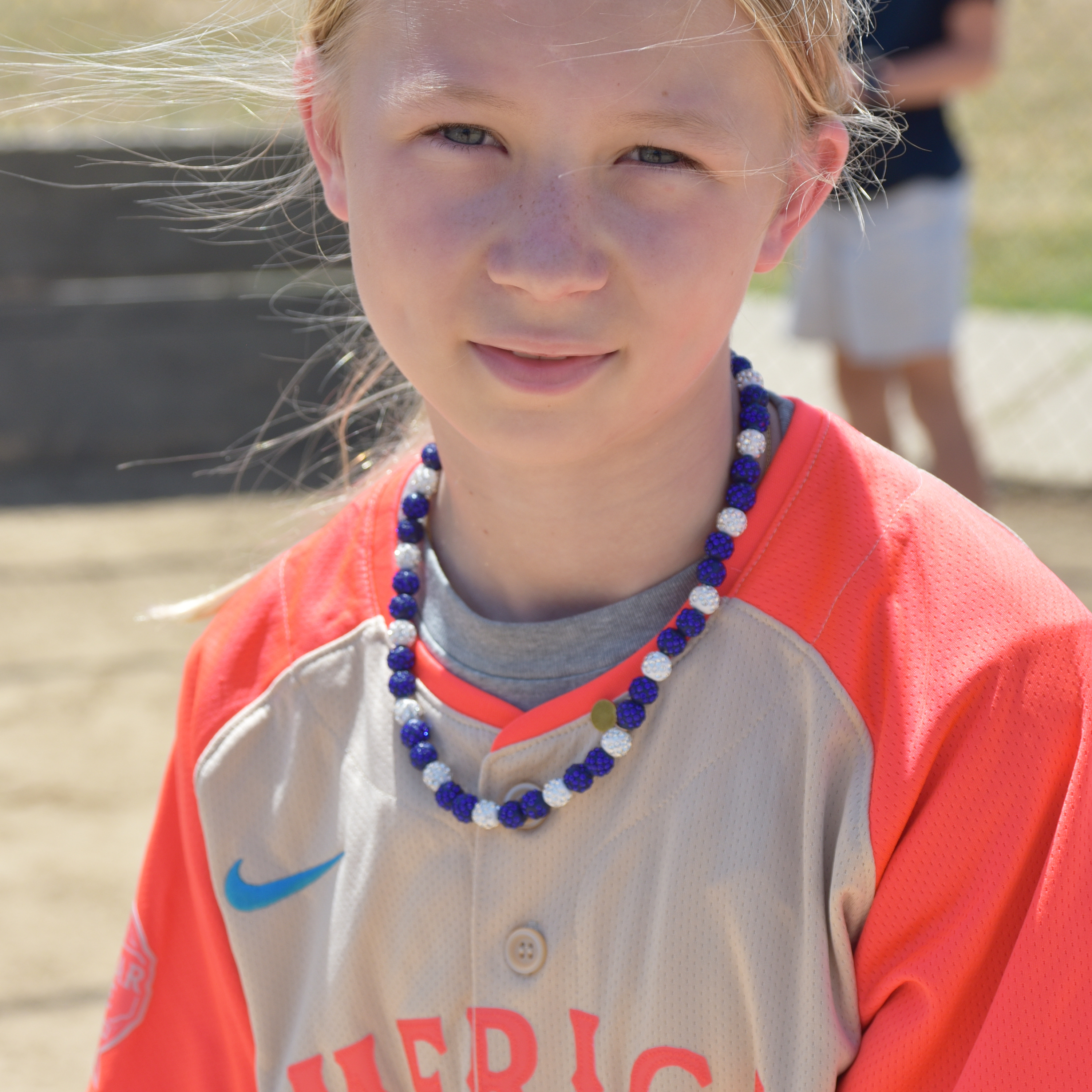 Young athlete wearing sport necklace