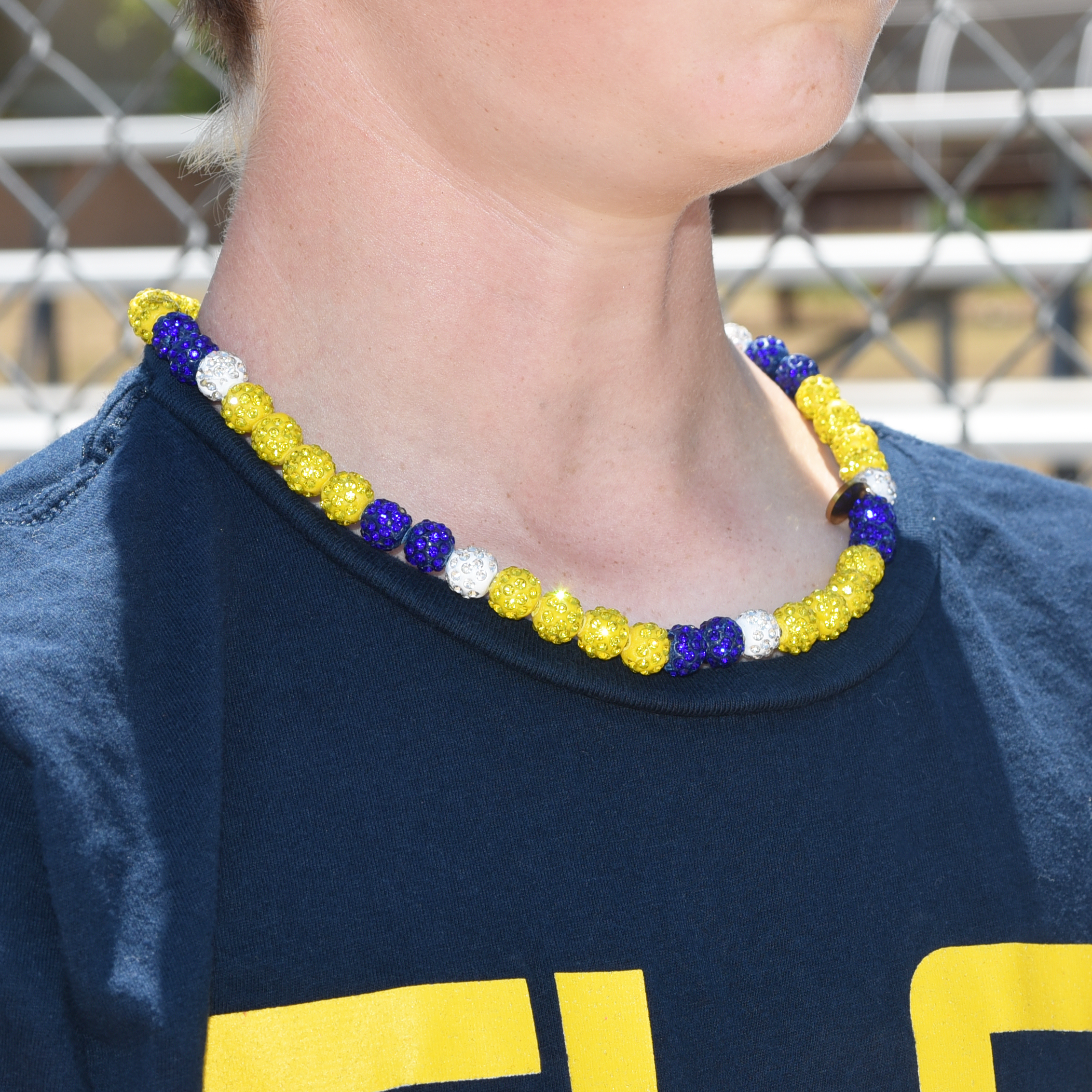 Close-up of a colorful beaded necklace after game day