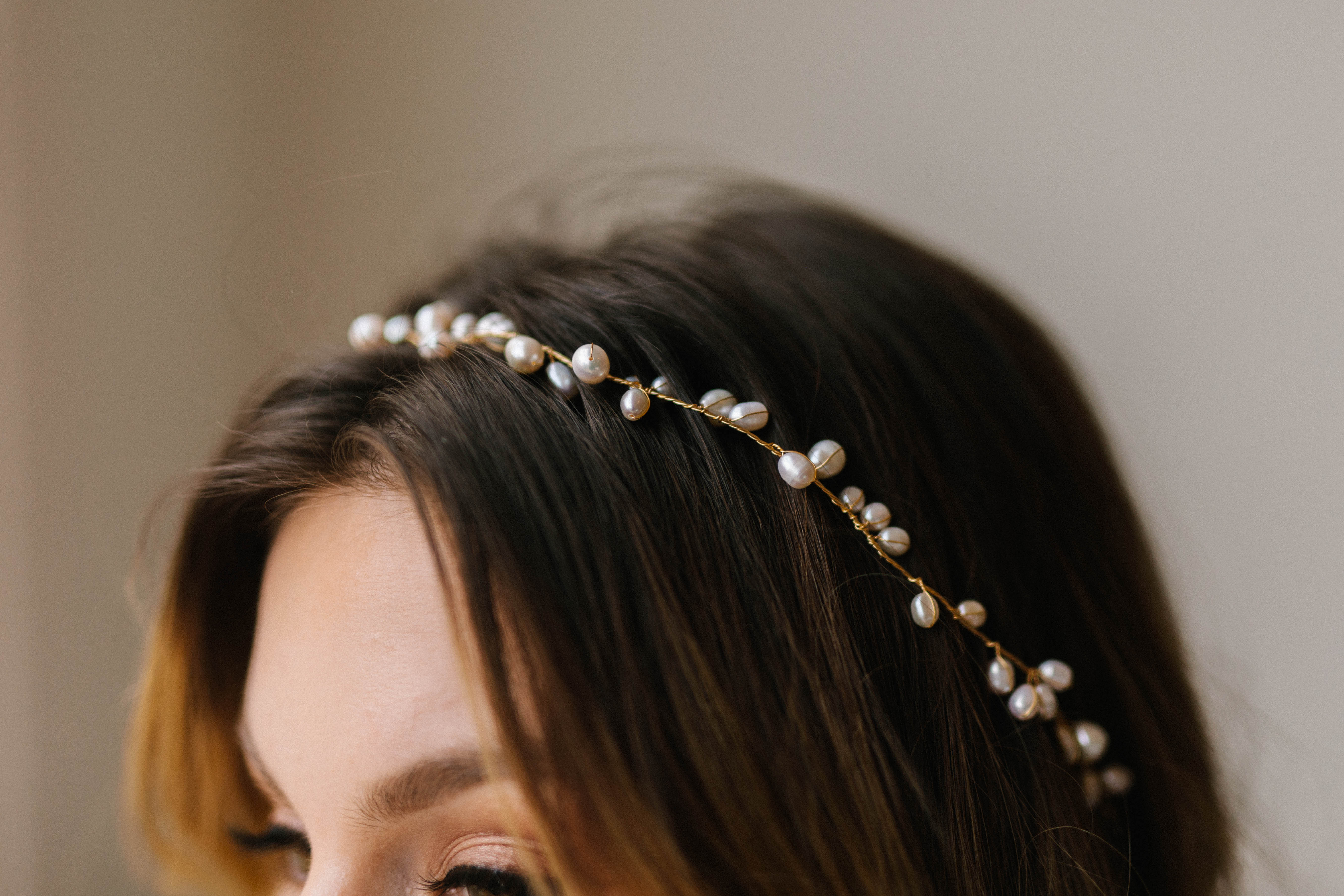 Layered necklaces styled with bridal neckline