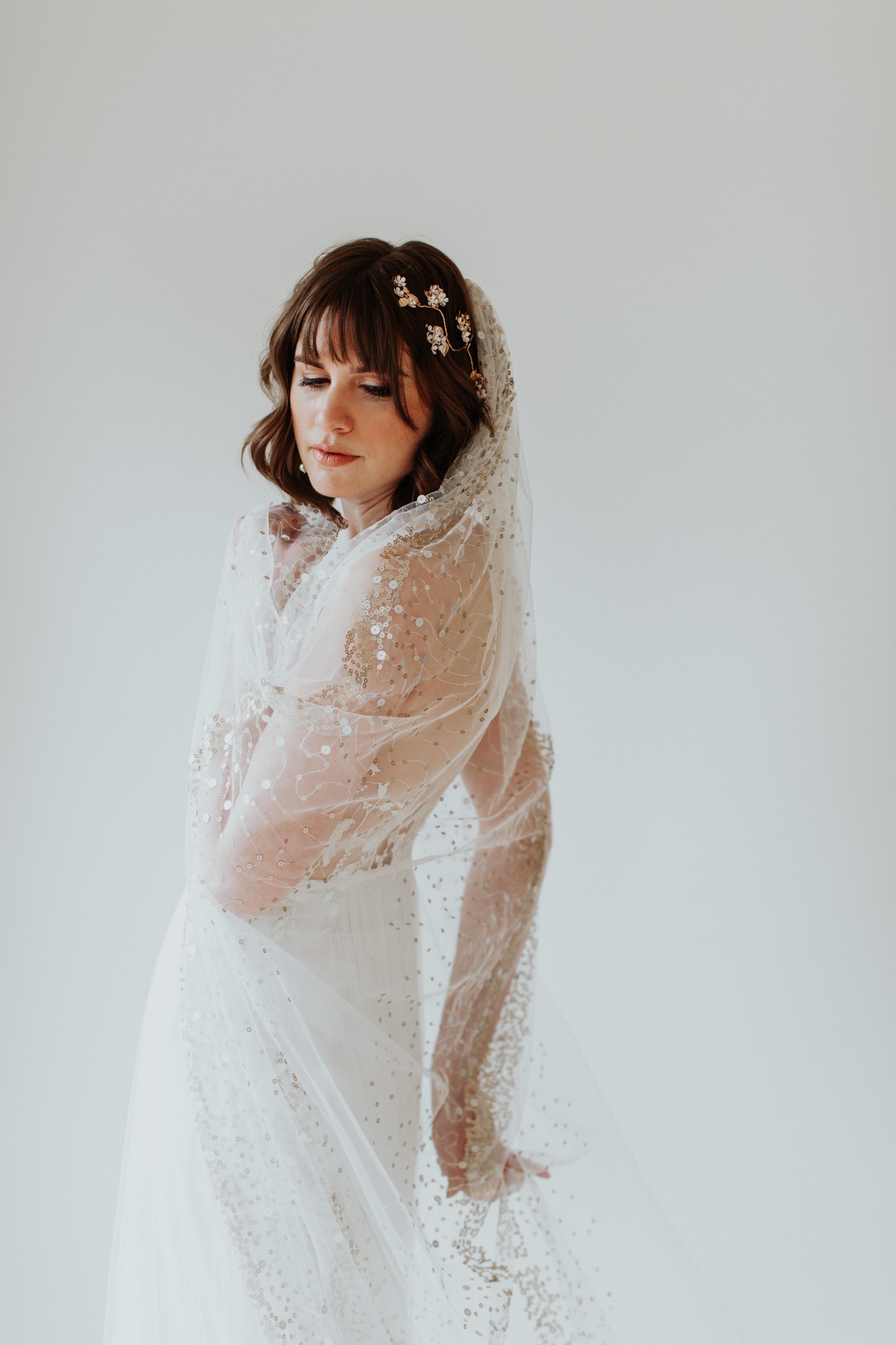 Boho bridal accessories arranged with dress