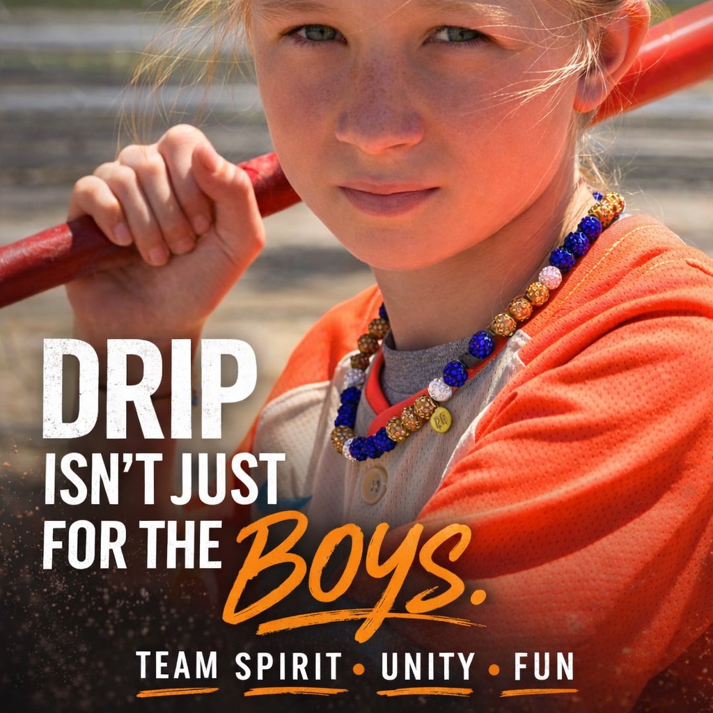 A person holds a baseball bat, wearing a beaded necklace and orange jersey.