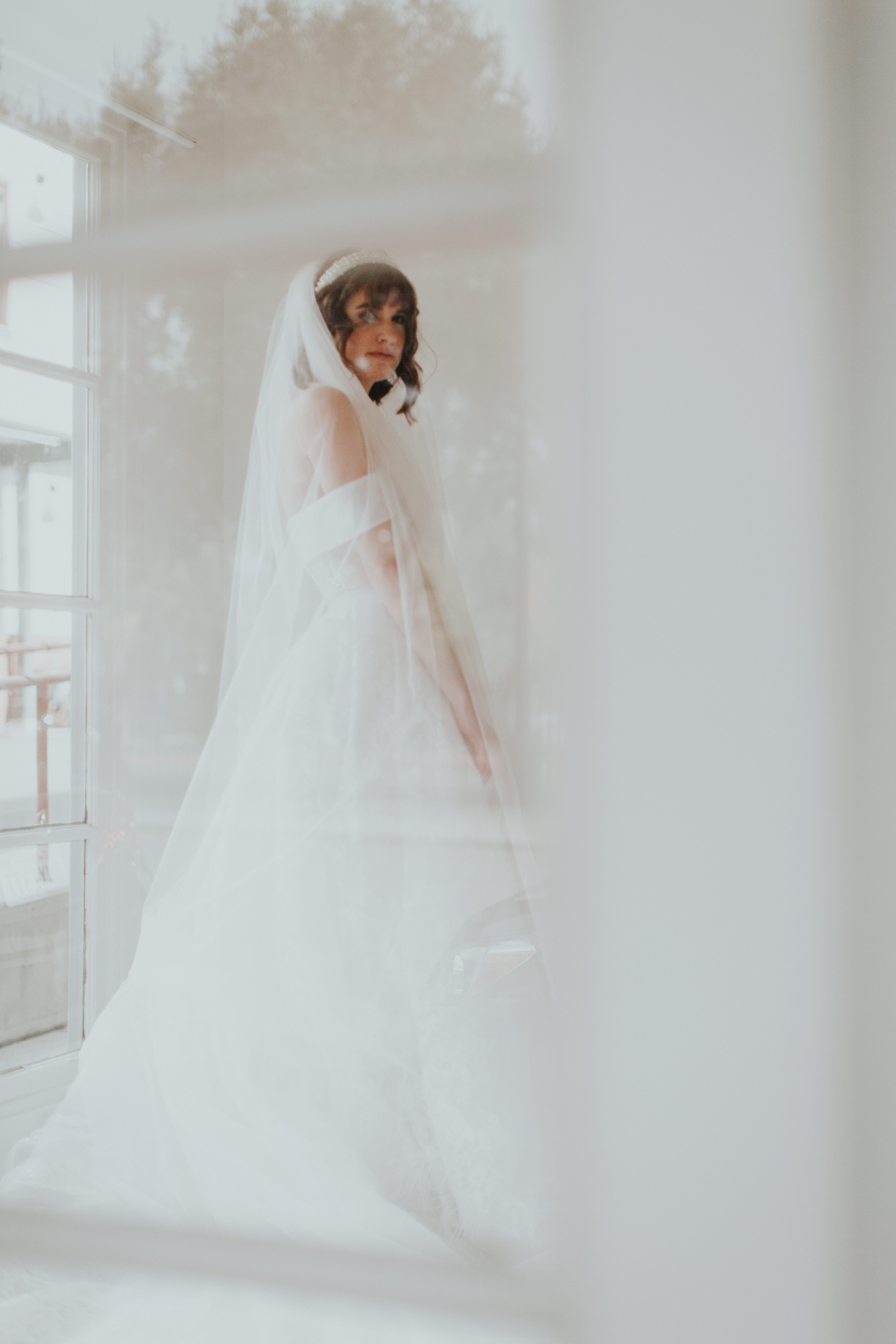 Wedding veil flowing with bridal silhouette