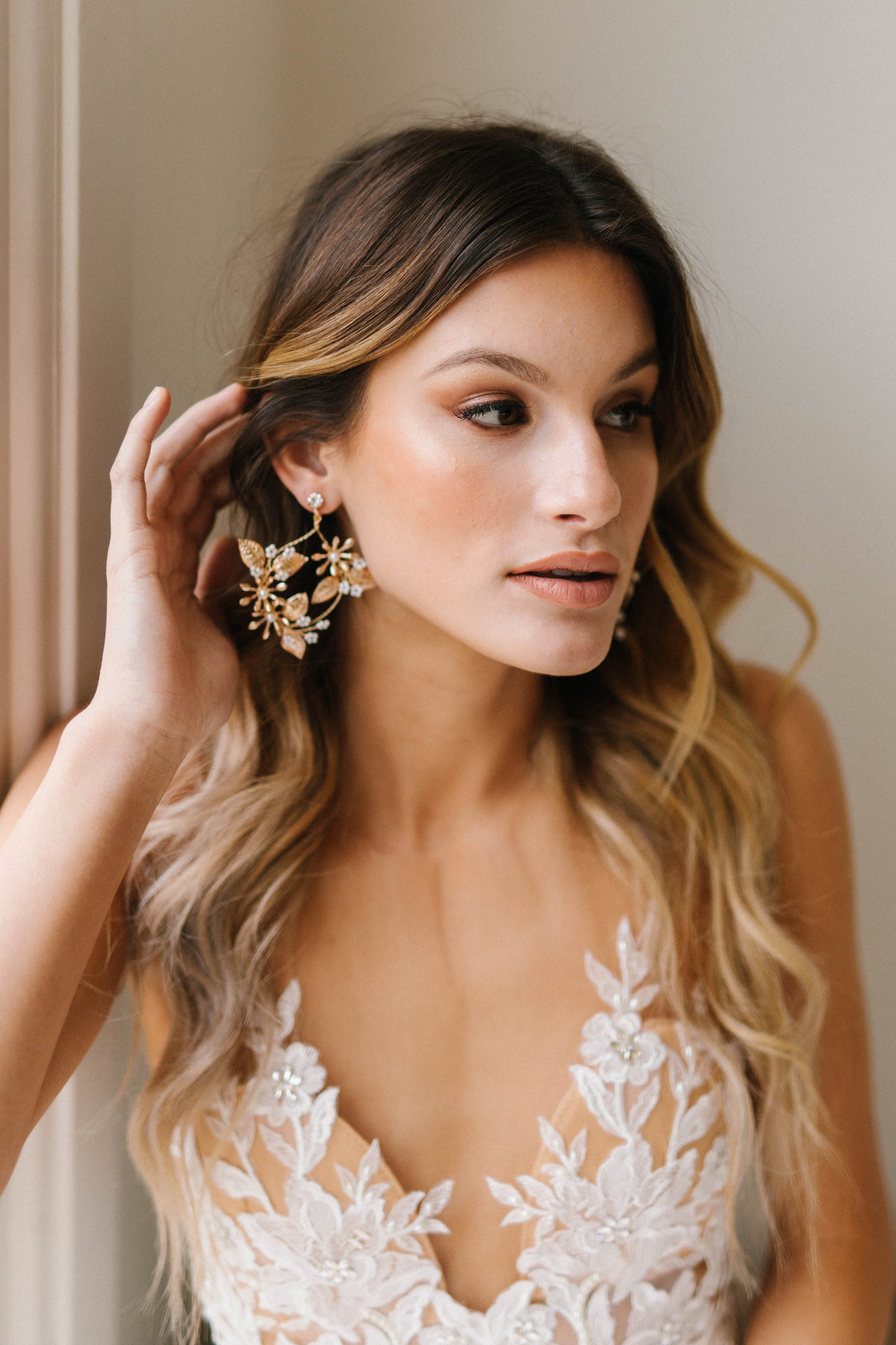 A gorgeous bride displaying her wedding theme accessories