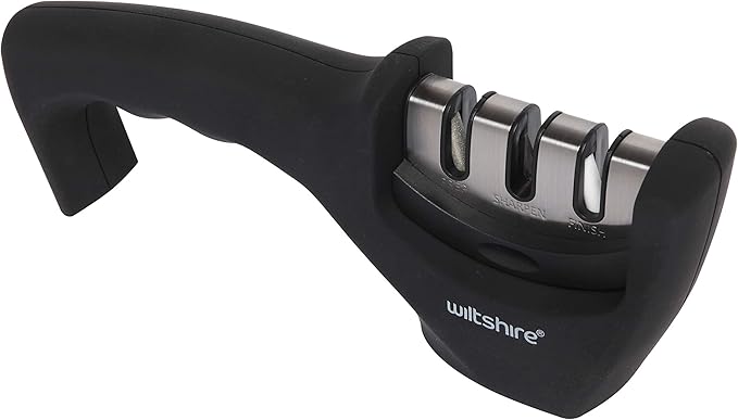 Pull-through knife sharpener with three sharpening slots.