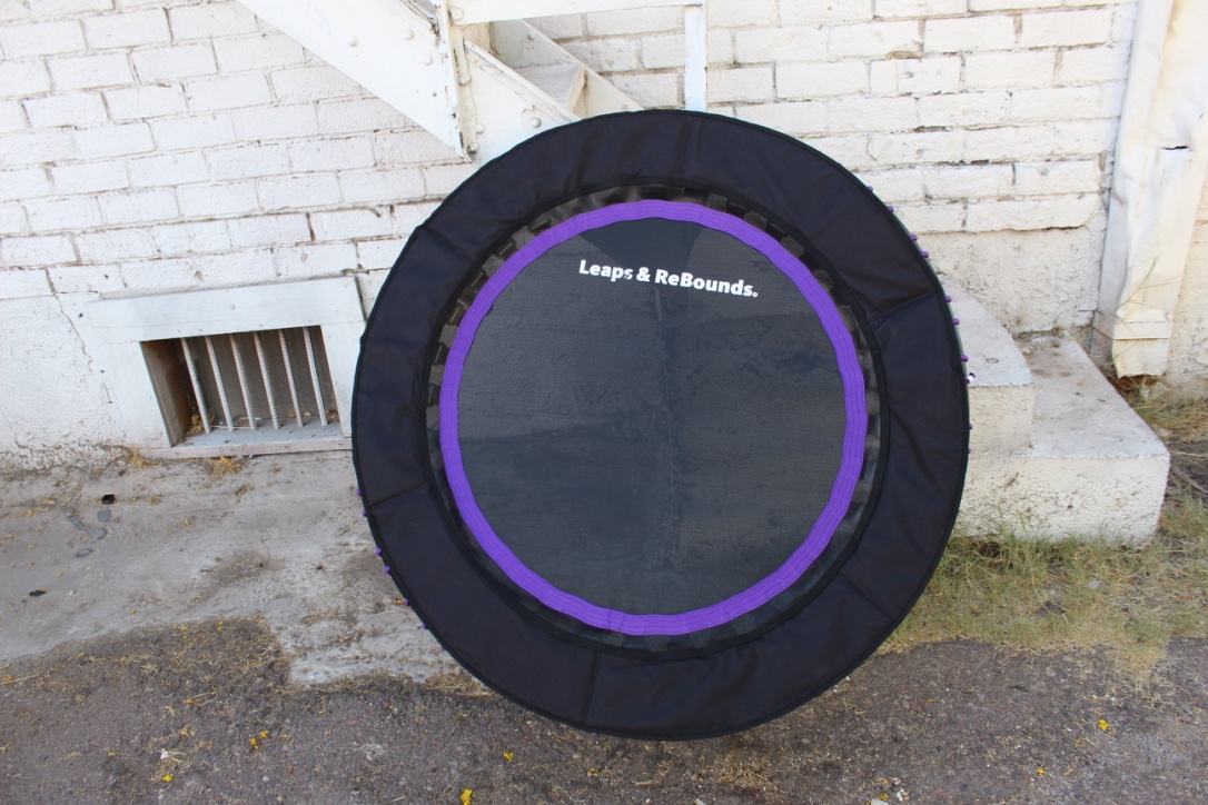 Mini trampoline leaning against a wall