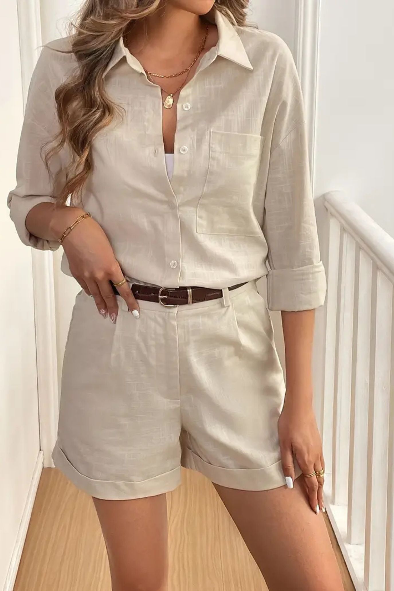 Short Outfit Set Model wearing a light beige outfit with shorts and a shirt.