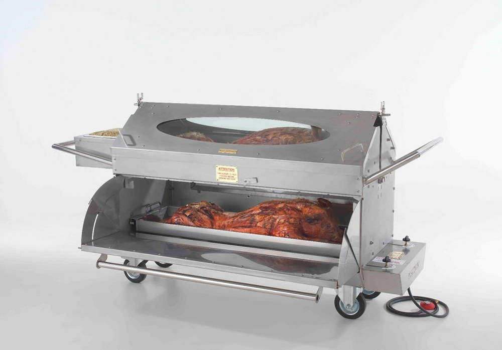 A whole hog roasting over an open fire outdoors.