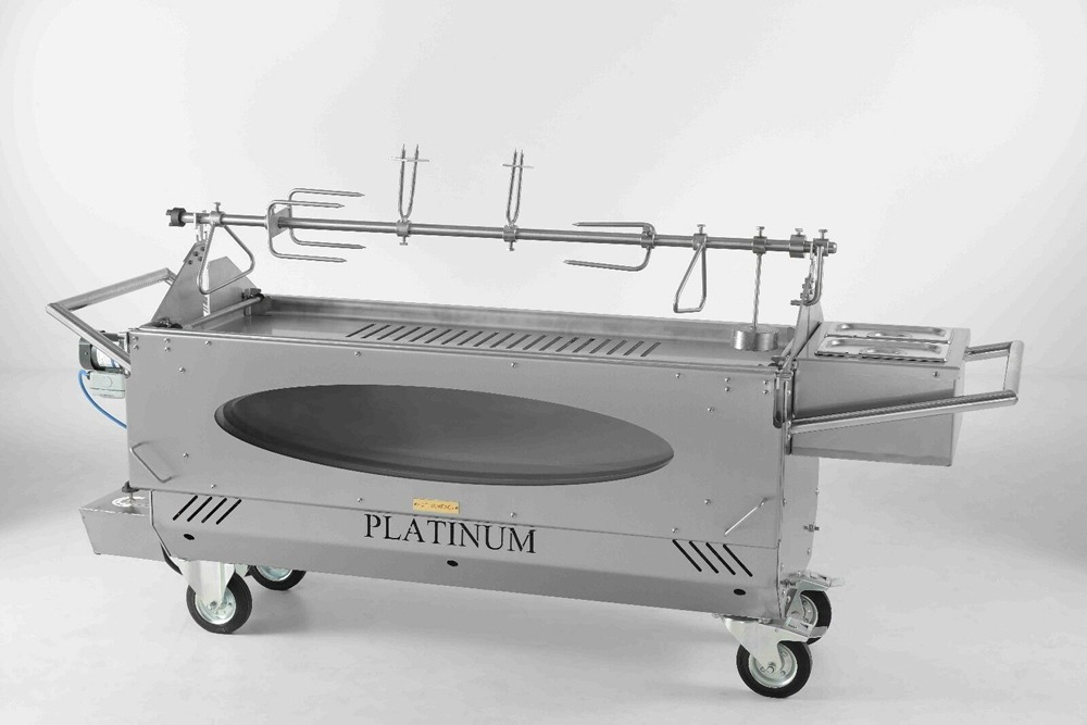 Whole hog roasting over glowing embers outdoors.