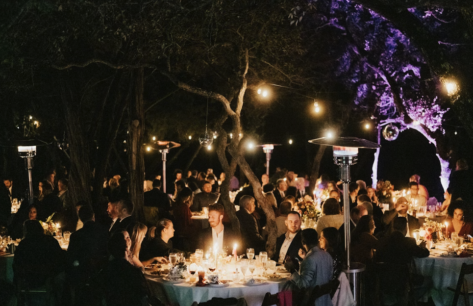 Two people collaborating on a flowchart with markers and sticky notes.